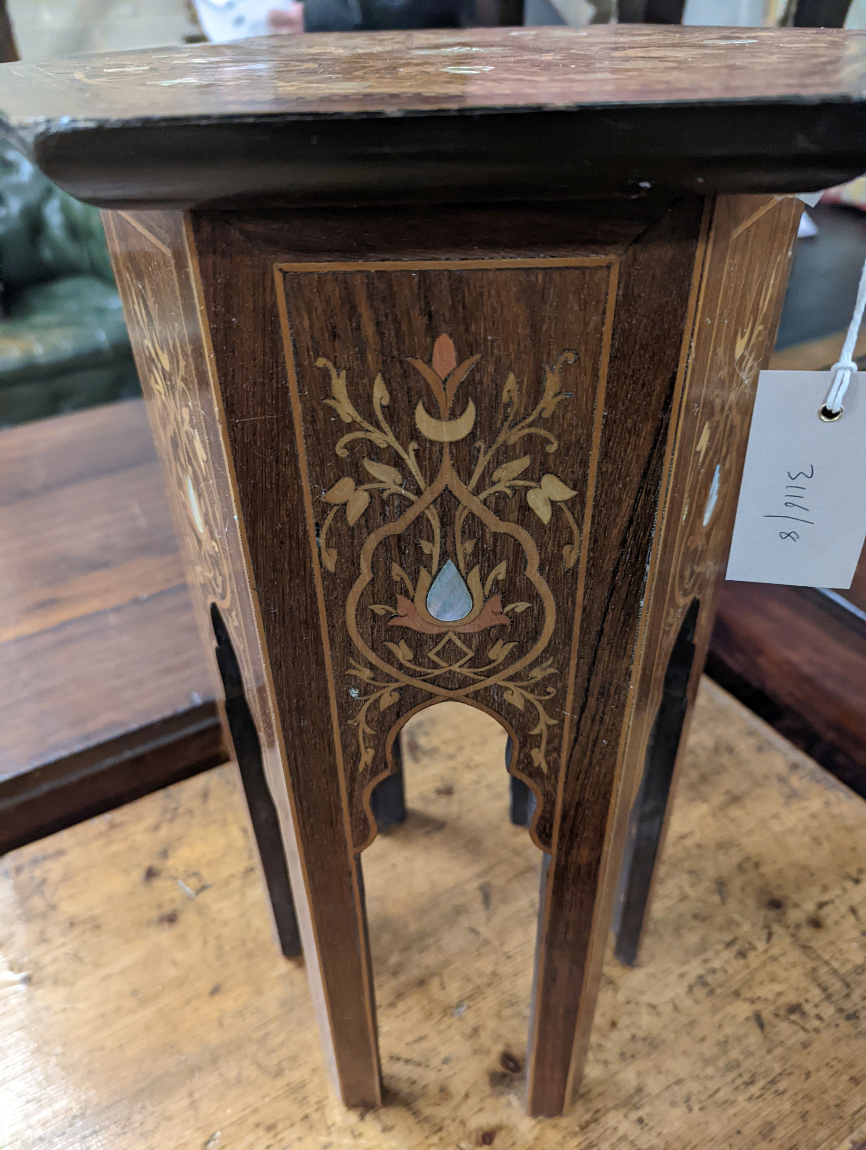 A Moorish mother of pearl and marquetry inlaid hexagonal occasional table, width 29cm, height 50cm